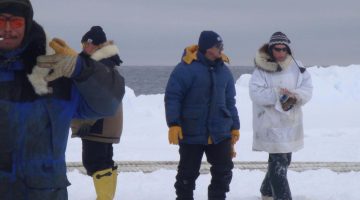 Alaska Sea Grant agent Paula Cullenberg with Native Alaskan hunters on North Slope G. Sheffield photo.