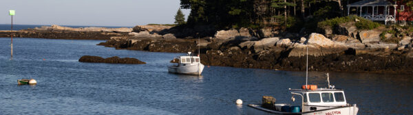 view of a harbor with a single fishing boat