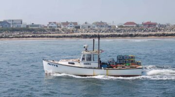 Lobster vessel with traps on the back