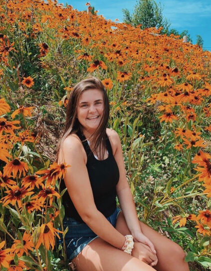 Isabel Descoteaux among a field of black-eyed susans