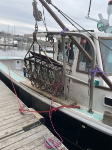 a working boat moored to a dock