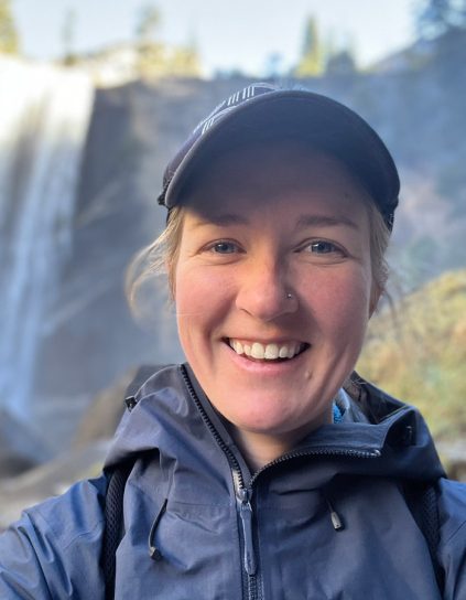 headshot of Annie Fagan with waterfall in background