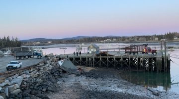 Equipment and building wreckage and debris on the coast