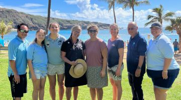 Maine Sea Grant's Keri Kaczor and Ohio Sea Grant's Jill Bartolotta pose with Hawaii Sea Grant's Marine Extension Team Leader, Darren Okimoto, and Education Staff Gavin Iwai, Anne Rosa, Morgan Mamizuka and two seasonal educators.