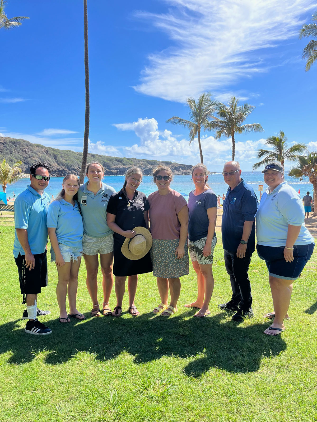 Maine Sea Grant's Keri Kaczor and Ohio Sea Grant's Jill Bartolotta pose with Hawaii Sea Grant's Marine Extension Team Leader, Darren Okimoto, and Education Staff Gavin Iwai, Anne Rosa, Morgan Mamizuka and two seasonal educators.