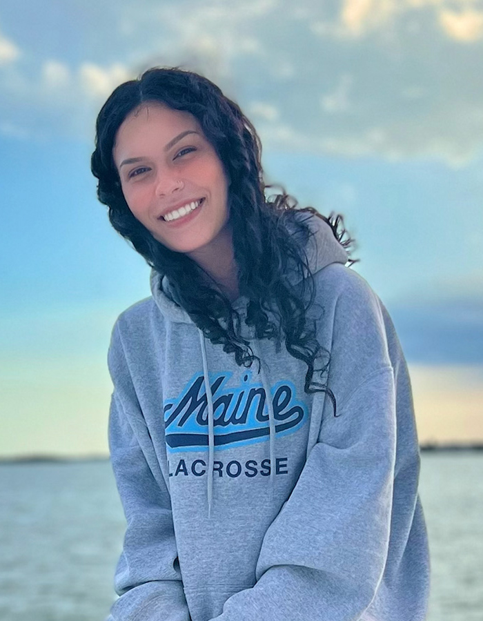 Aimee with the ocean at her back